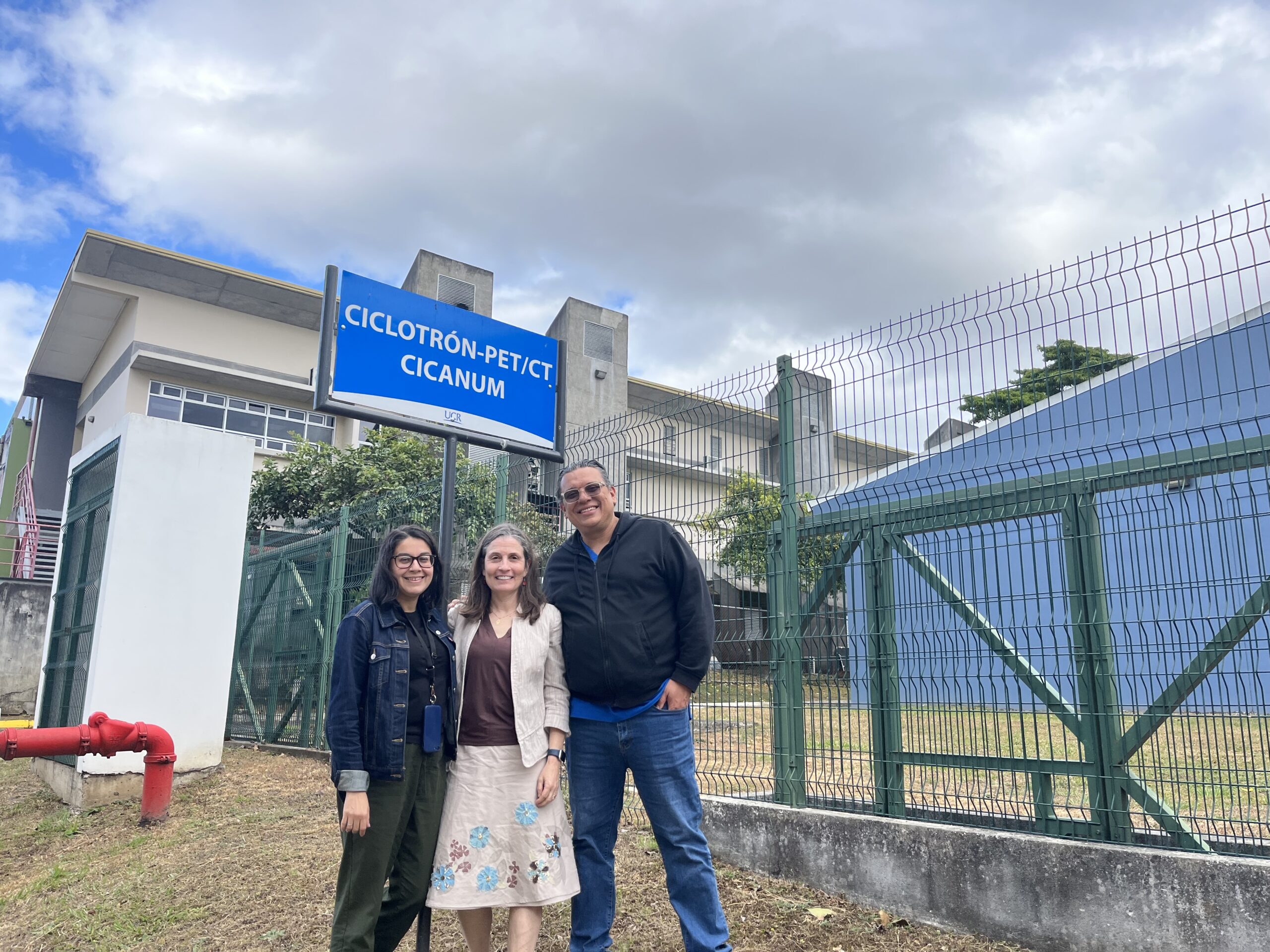 Jennifer Smilowitz in Costa Rica in front of the cyclotron building